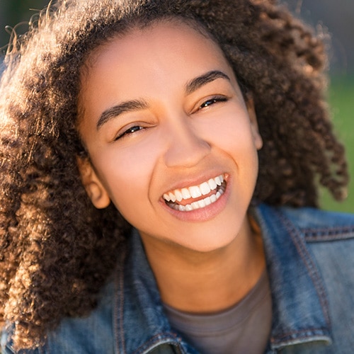 Girl smiling at Ossa Orthodontics in Caldwell, OH